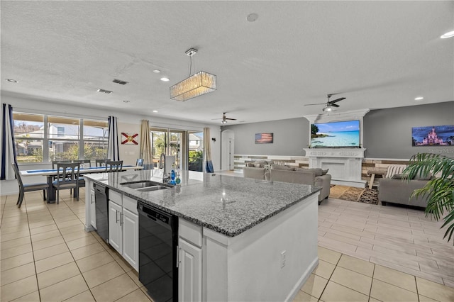 kitchen with sink, hanging light fixtures, dishwasher, a kitchen island with sink, and white cabinets