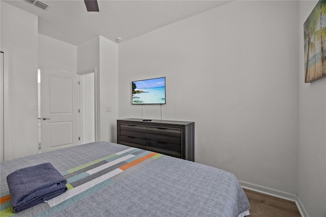 bedroom with hardwood / wood-style flooring and ceiling fan