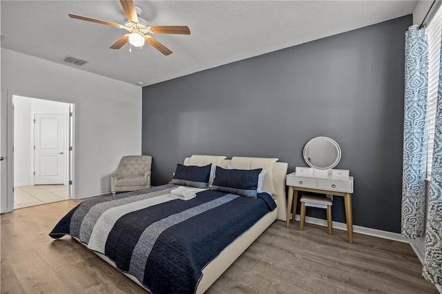 bedroom featuring ceiling fan and hardwood / wood-style floors