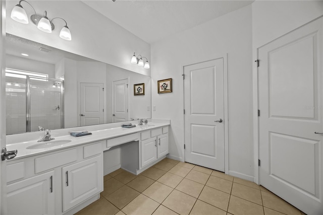 bathroom with vanity, tile patterned floors, and walk in shower