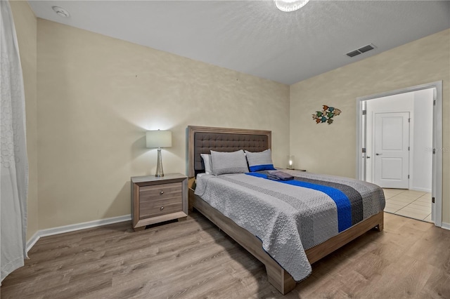 bedroom featuring light wood-type flooring