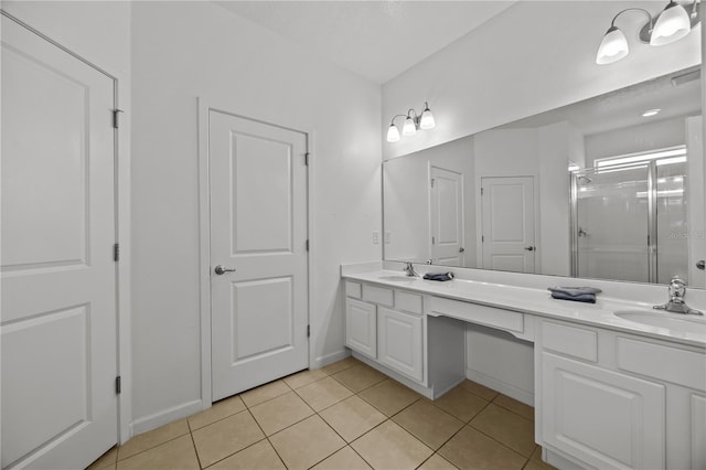 bathroom with tile patterned floors, a shower with shower door, and vanity