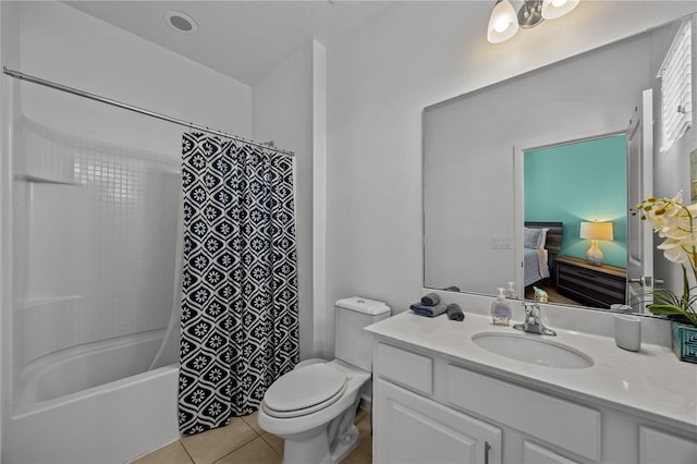 full bathroom with vanity, tile patterned floors, toilet, and shower / bath combo