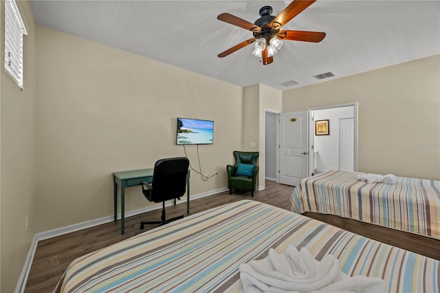 bedroom with dark wood-type flooring and ceiling fan