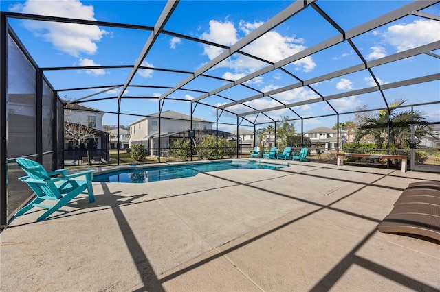 view of pool featuring a lanai and a patio area