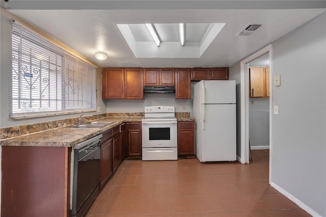 kitchen with sink and white appliances