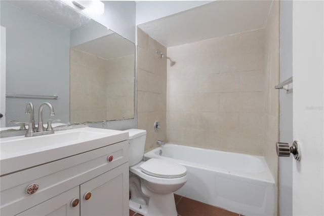 full bathroom with toilet, vanity, and tiled shower / bath