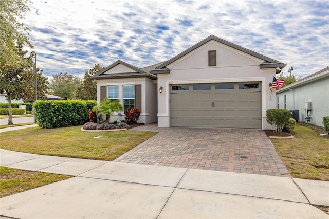 view of front facade featuring a front yard and a garage