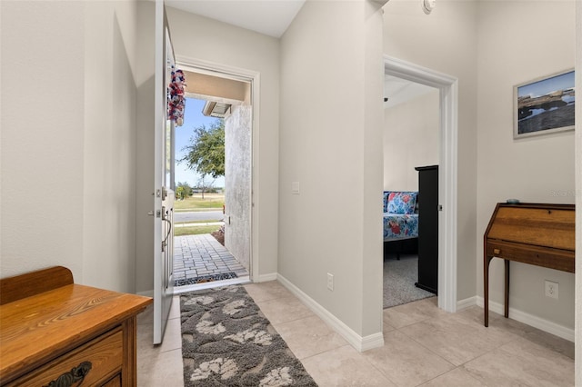 entrance foyer featuring light tile patterned floors