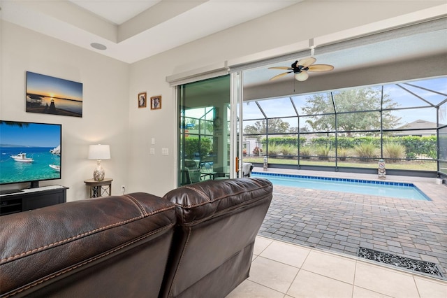 tiled living room featuring ceiling fan