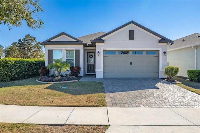 view of front facade featuring a garage and a front lawn