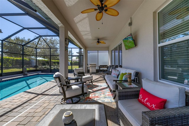 view of patio / terrace featuring a fenced in pool, an outdoor living space, glass enclosure, and ceiling fan