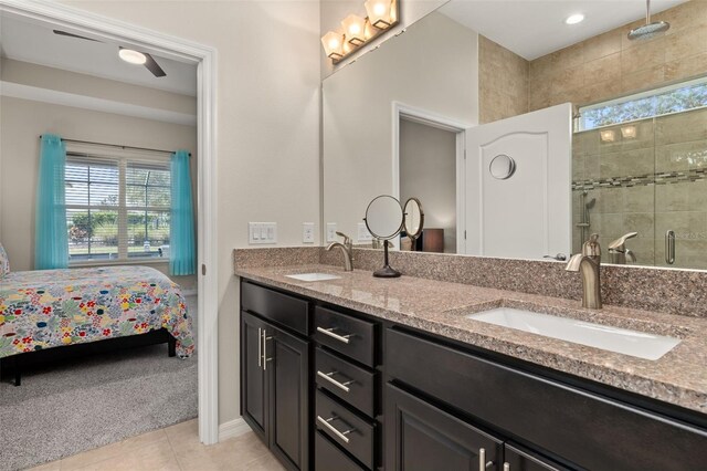 bathroom featuring vanity, tile patterned flooring, and a shower with door