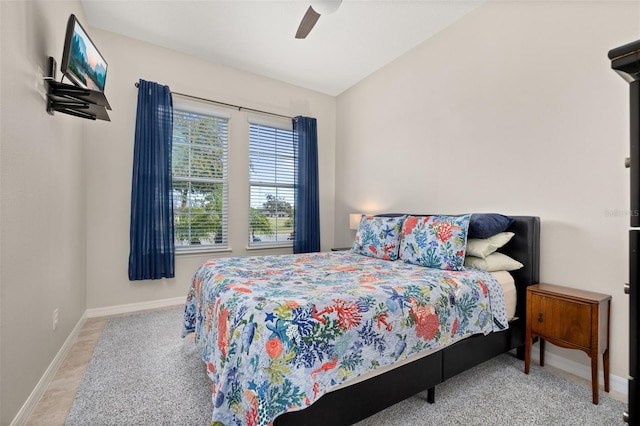 bedroom featuring ceiling fan and vaulted ceiling