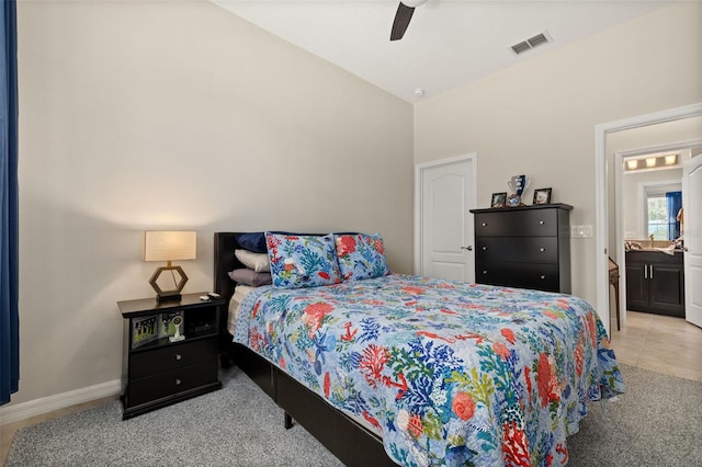 tiled bedroom featuring vaulted ceiling and ceiling fan