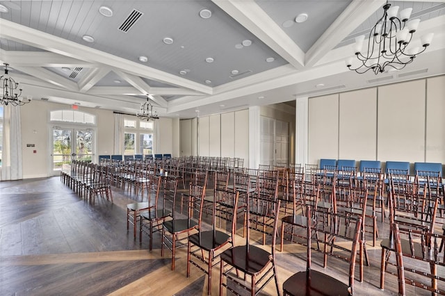 misc room featuring beam ceiling, wood-type flooring, french doors, coffered ceiling, and an inviting chandelier