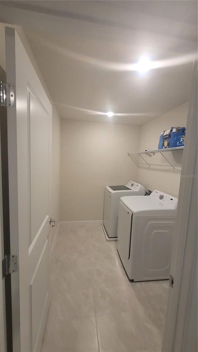 laundry room with separate washer and dryer