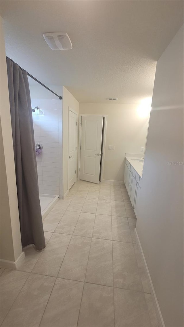 corridor featuring light tile patterned flooring