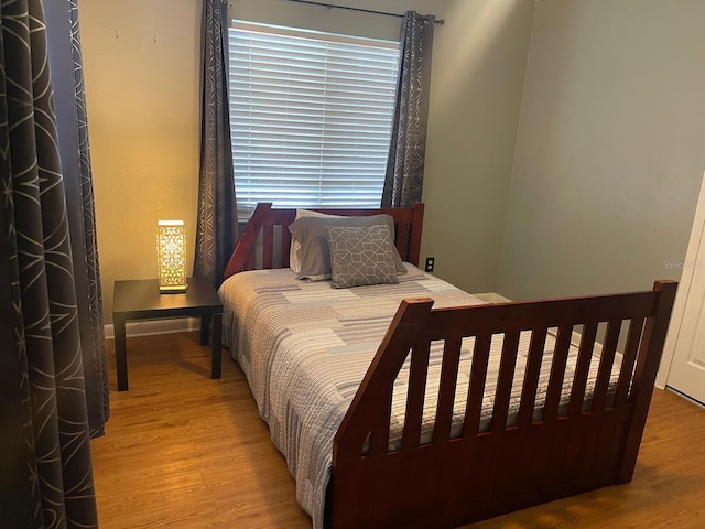 bedroom featuring light wood-type flooring