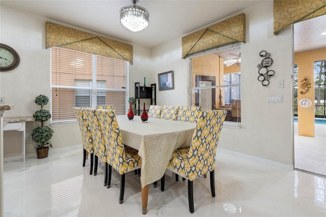 dining space featuring a notable chandelier