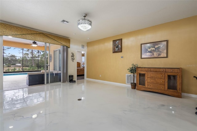 unfurnished living room with ceiling fan