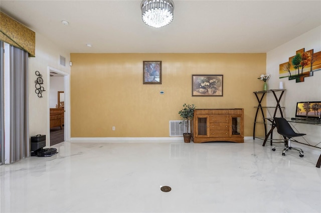 interior space featuring an inviting chandelier and concrete flooring