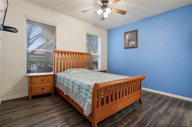 bedroom with ceiling fan and dark wood-type flooring