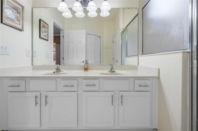 bathroom with walk in shower and vanity