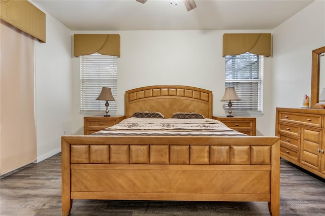 bedroom with ceiling fan and dark hardwood / wood-style floors