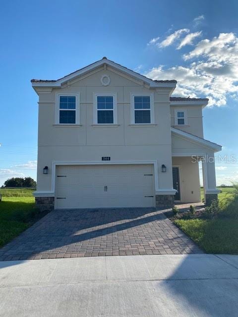 view of front of property featuring a garage