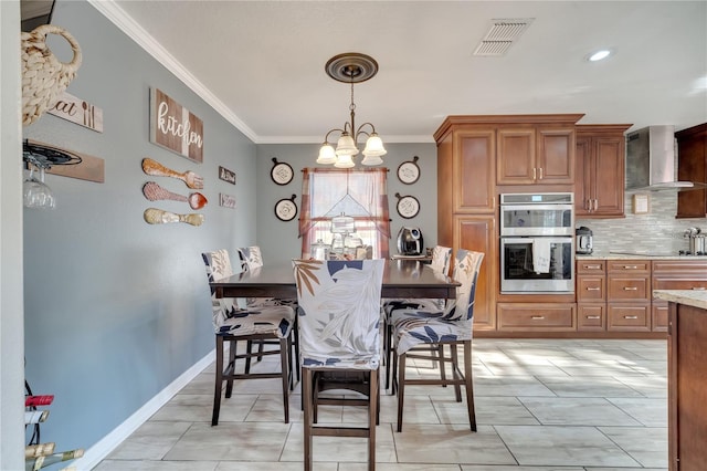 dining room featuring a notable chandelier and ornamental molding