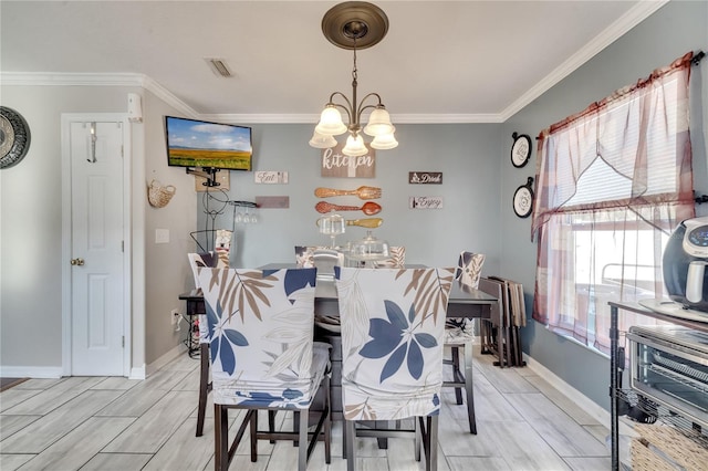 dining area featuring an inviting chandelier and ornamental molding