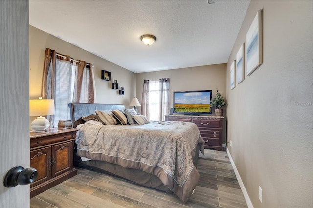 bedroom featuring a textured ceiling