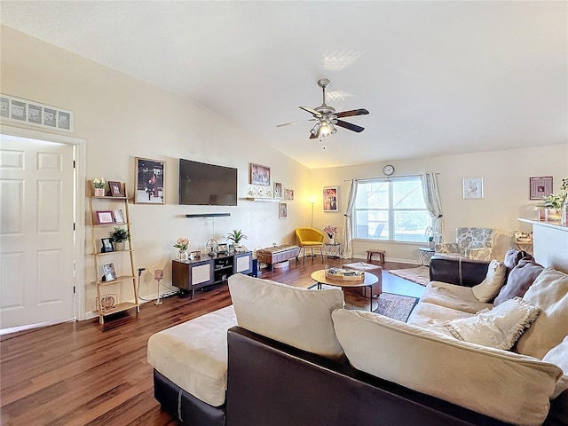 living room featuring lofted ceiling, dark wood-type flooring, and ceiling fan