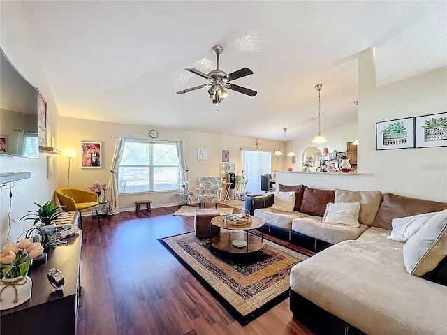 living room with ceiling fan, lofted ceiling, and dark hardwood / wood-style floors