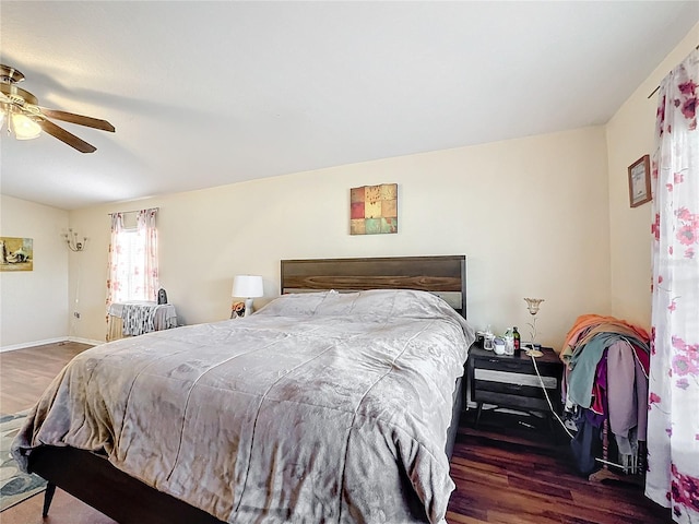 bedroom featuring dark wood-type flooring and ceiling fan