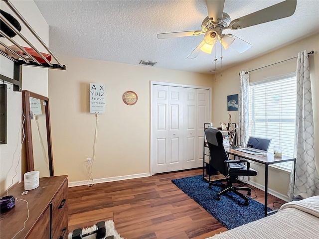 office area featuring hardwood / wood-style flooring, ceiling fan, and a textured ceiling