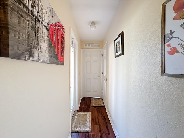 hallway featuring dark hardwood / wood-style floors