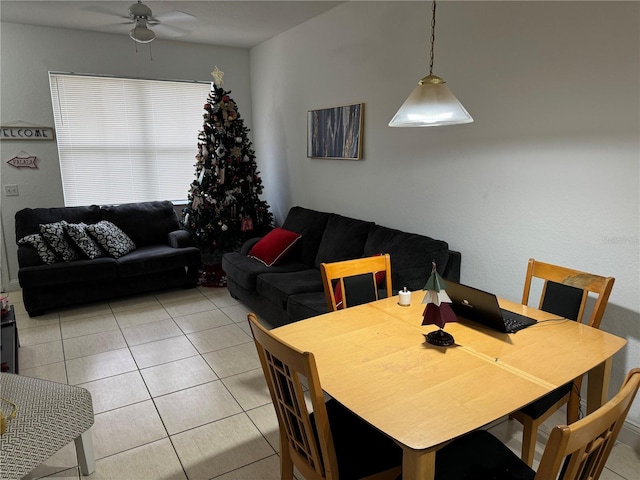 dining area featuring ceiling fan and light tile patterned flooring