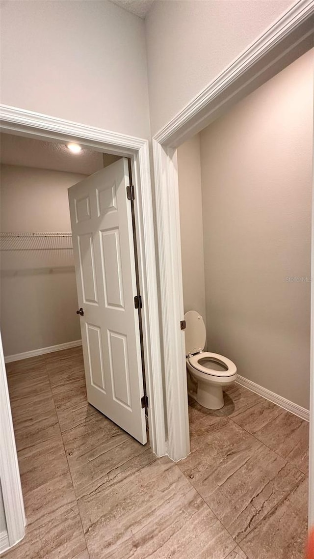 bathroom featuring toilet