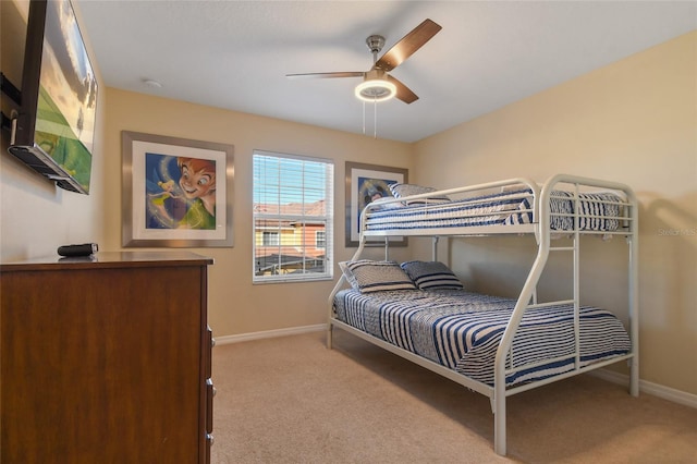 bedroom featuring ceiling fan and light colored carpet