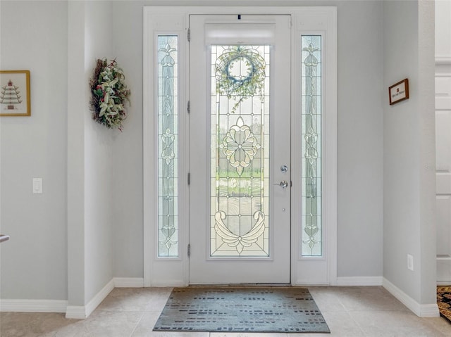 foyer featuring light tile patterned flooring