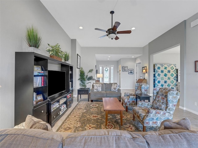 tiled living room with ceiling fan