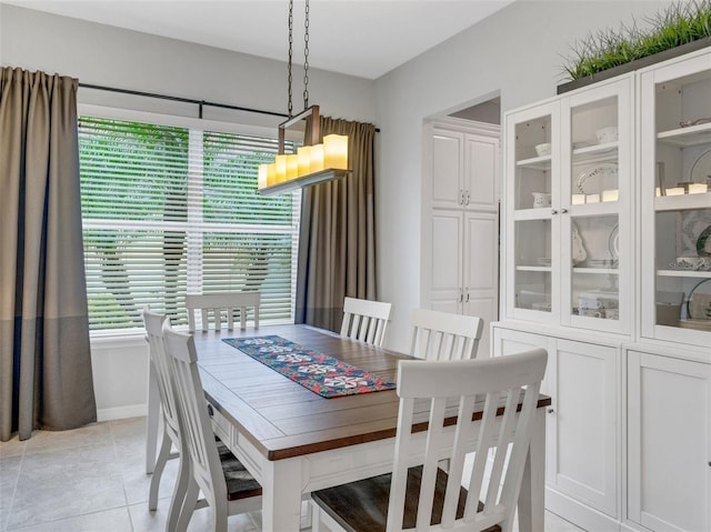 dining area featuring light tile patterned floors