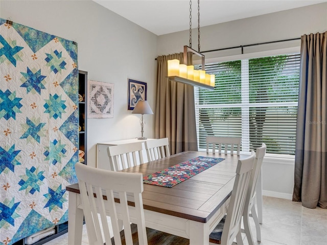 dining area with tile patterned flooring