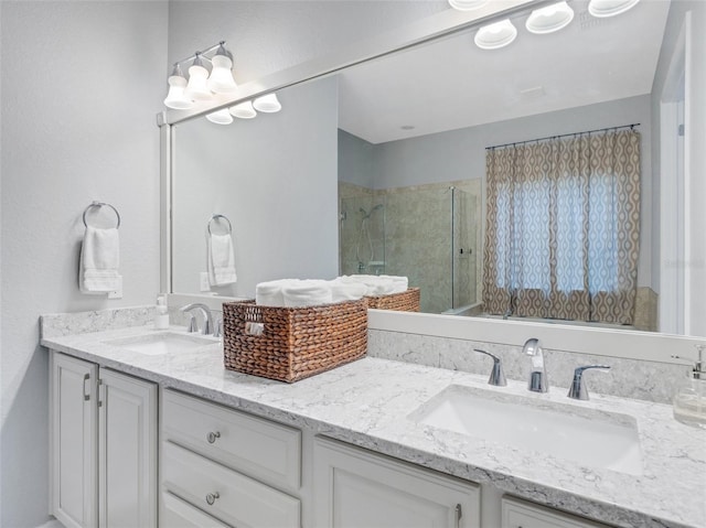 bathroom with vanity and a shower with shower door