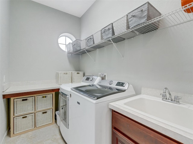 laundry area with sink and washer and clothes dryer