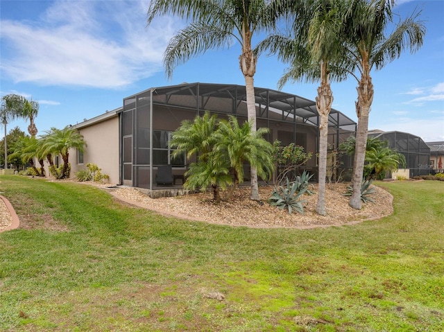 view of yard featuring glass enclosure