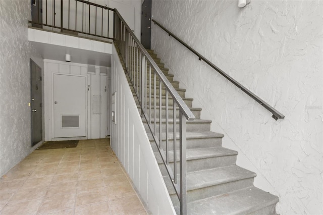 stairway with a high ceiling