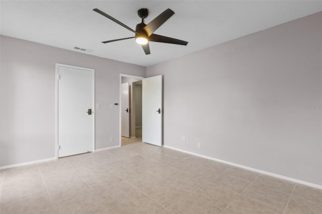 spare room with ceiling fan